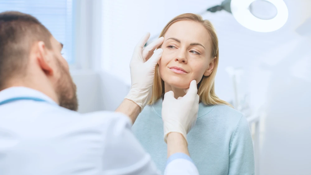 Patient receiving consultation for cosmetic surgery